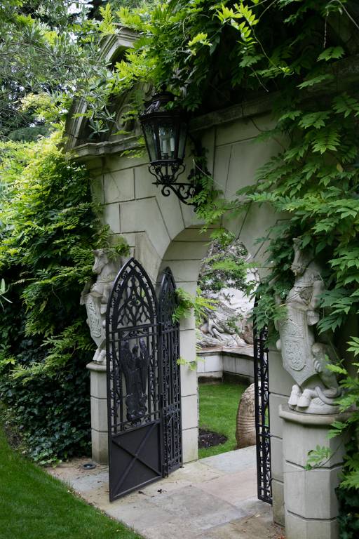 Garden archway and gate rendered blockwork with reclaimed stone statuary and ironwork, 2013