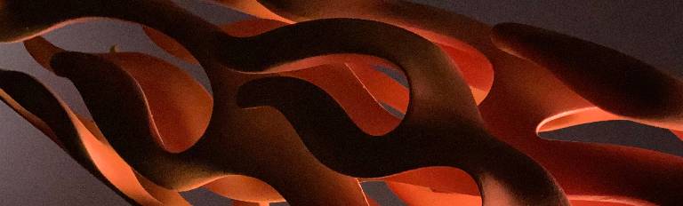 Hand carved flame detail with a laquered finish from a sculpture illuminated from within