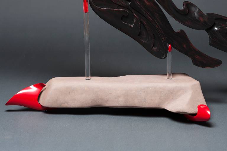 sandstone, lacquered lime and perspex detail of the sculptures mounting