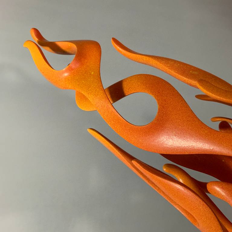 flame red and orange laquered finish of the sculpture