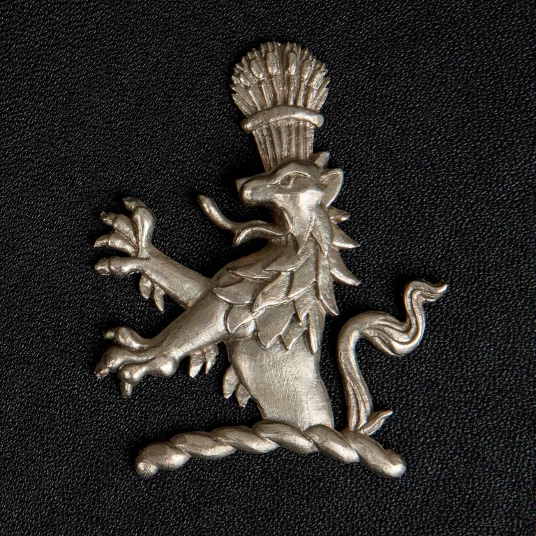 A pewter heraldic emblem designed and made by Misti Leitz