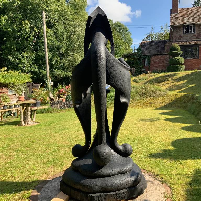 carved and burnt oak abstract statue